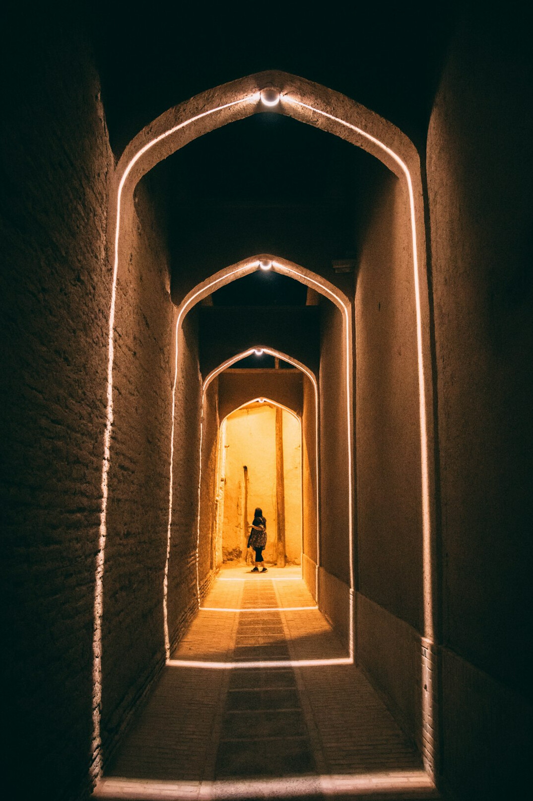 shadowy figure in alley at night